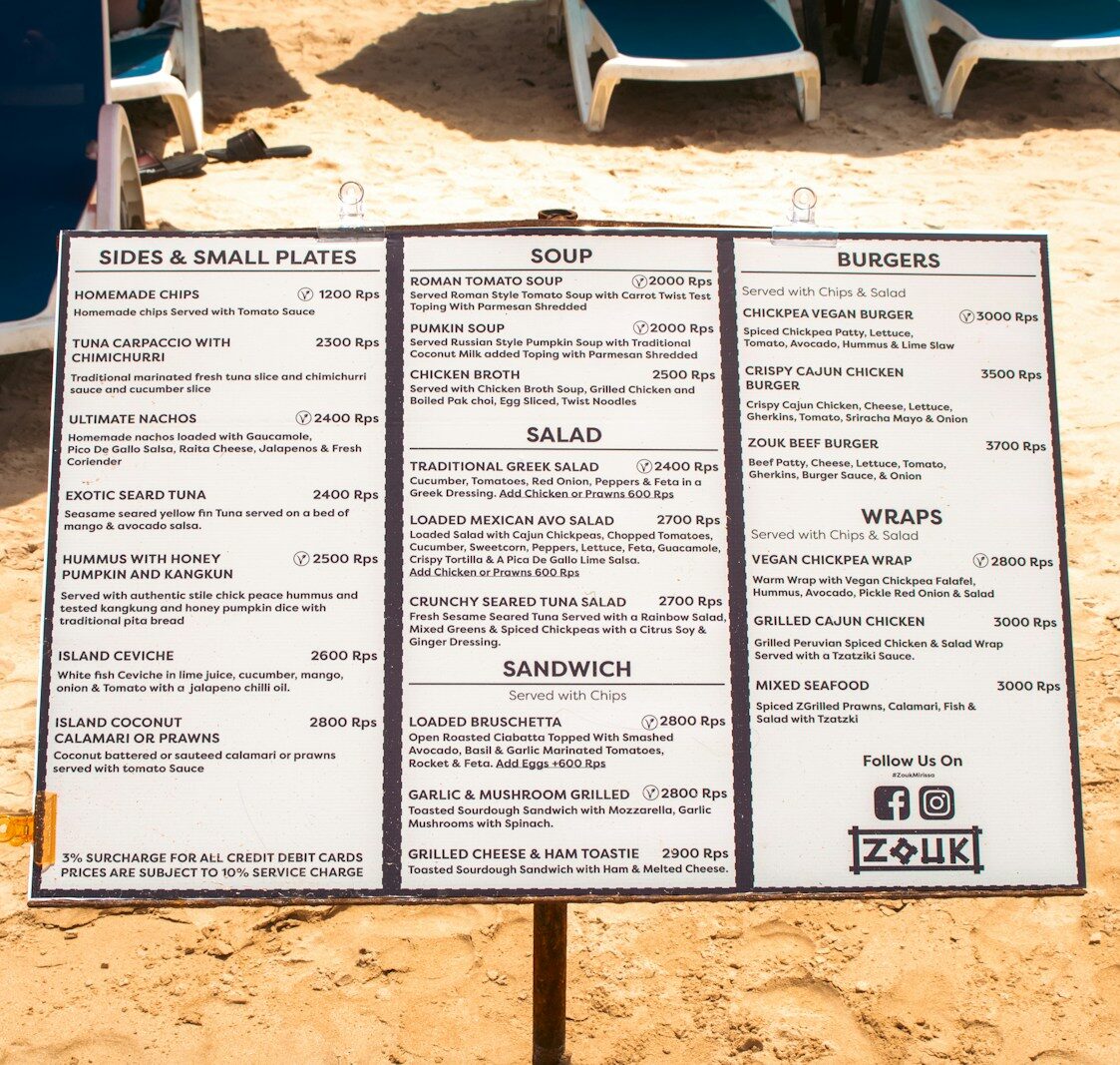 The beachside menu displays various food options.