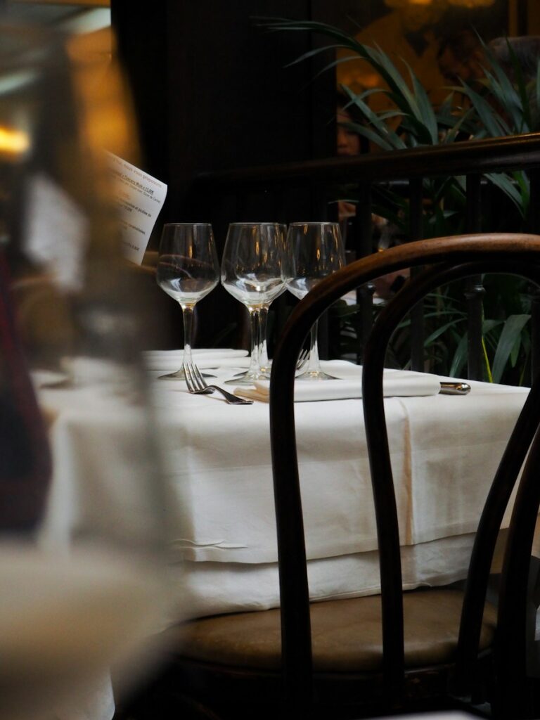 Restaurant table set with wine glasses and cutlery